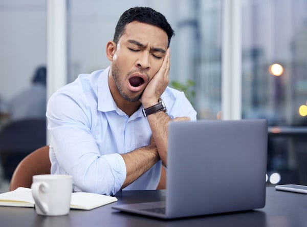 MotleyFool-TMOT-39694fd5-yawning-man-laptop.jpg